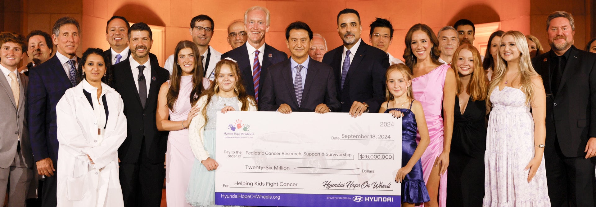 helping kids fight cancer foundation showing their big check from hyundai hope on wheels - Hyundai of San Bruno in San Bruno CA
